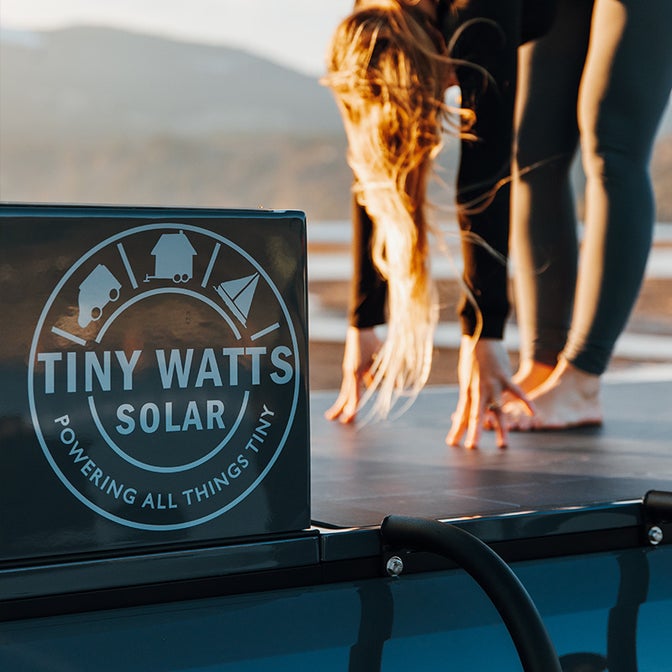 Person Standing on One of Tiny Watts Off Grid Solar Kits